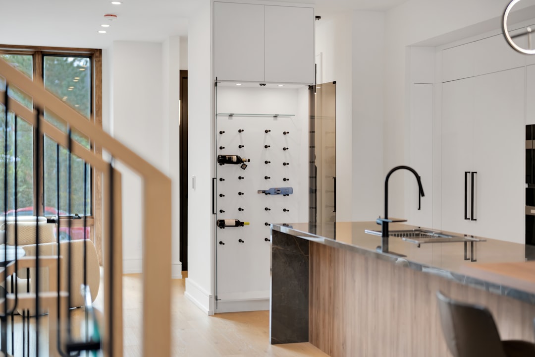 summer-sale modern-kitchen-with-wine-rack-and-island-aju-lo3npa