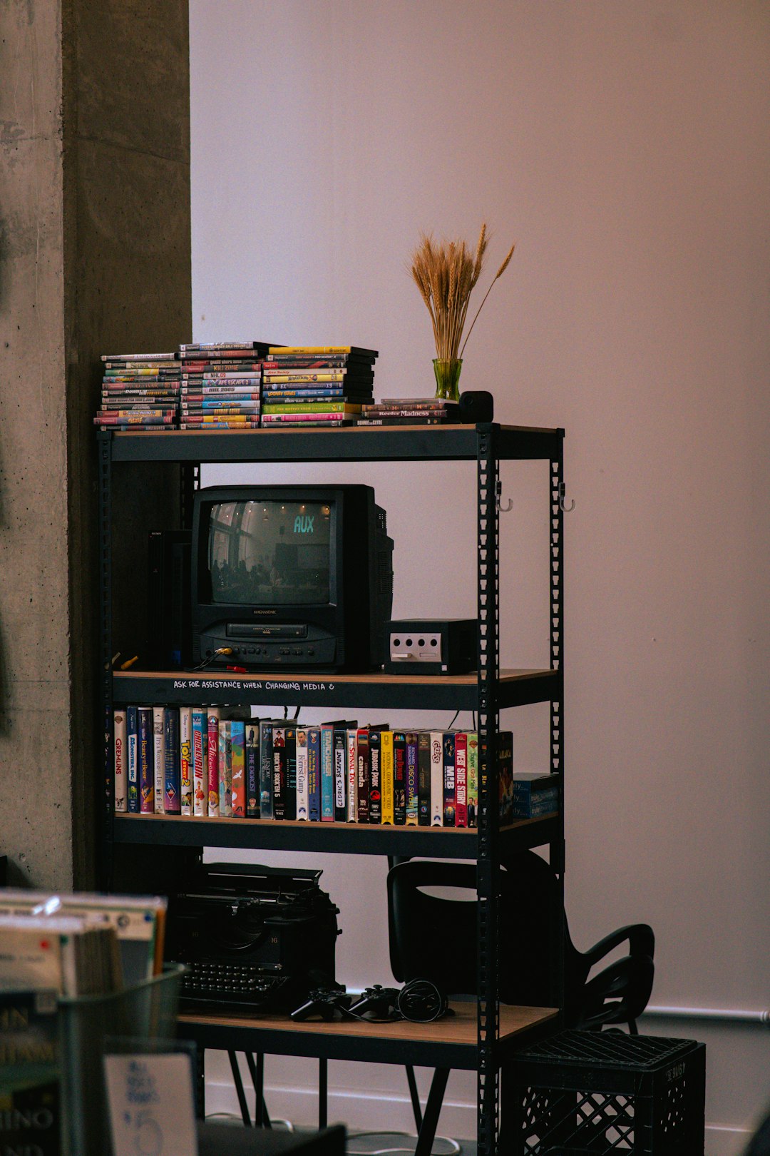 bedroom-bliss shelf-with-old-television-vhs-tapes-and-typewriter-dsc3xb2zoe0